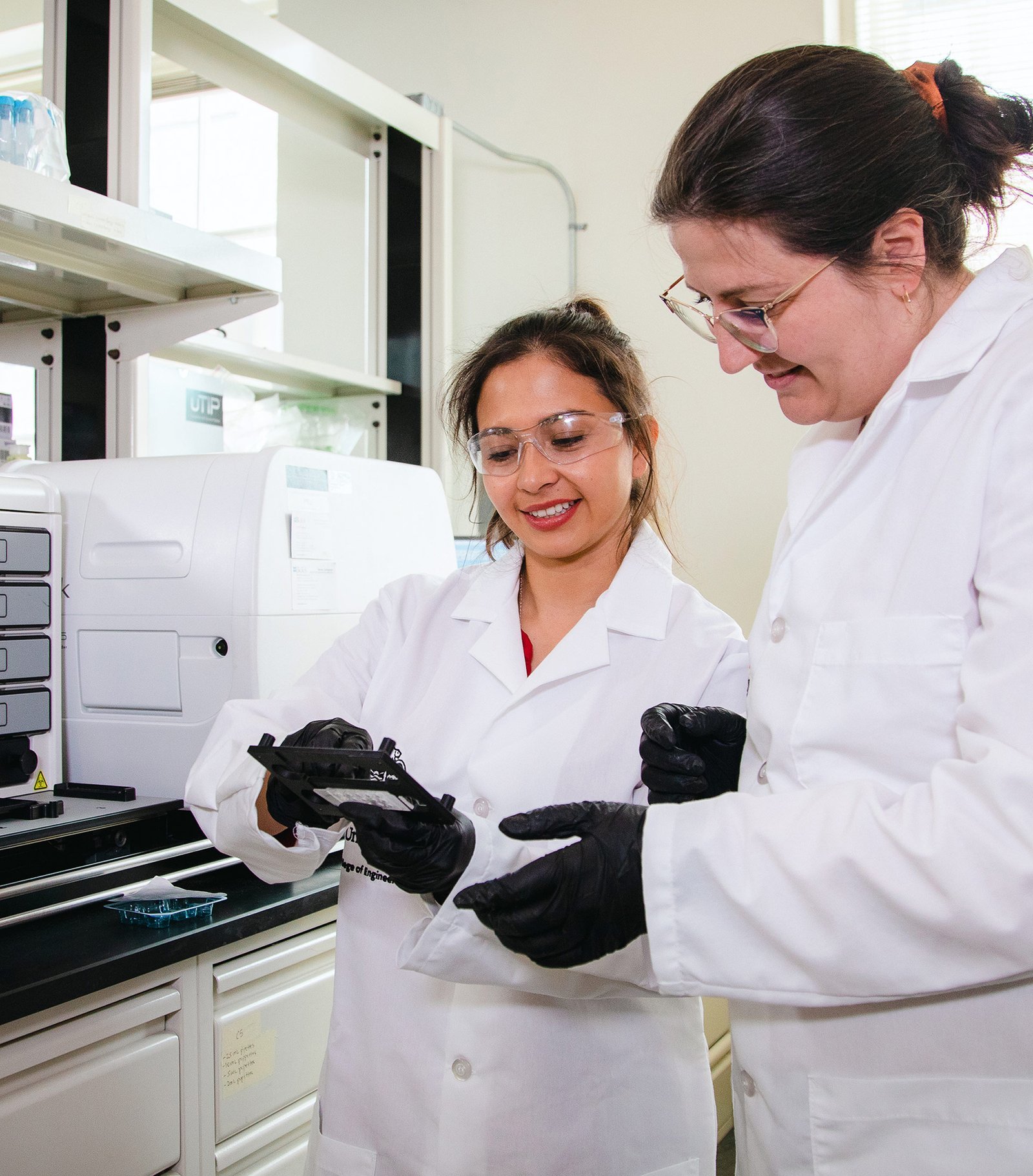 Two scientists looking at a sample